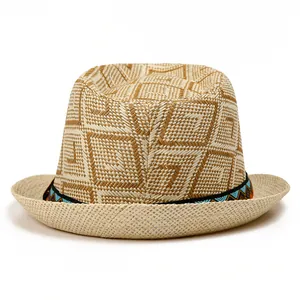 Close-up of beige straw fedora with ethnic geometric pattern ribbon band