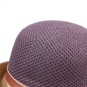 Detail of purple woven cloche hat showing fine crochet texture and brown leather trim
