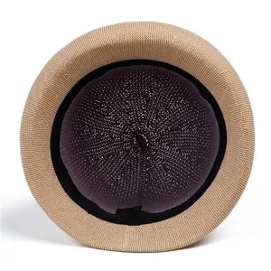 Detailed interior of khaki knitted sun hat showing sweatband and crochet texture