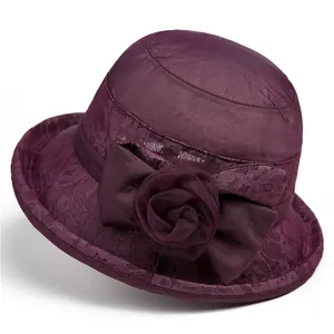 Elegant purple cloche sun hat for women with mesh top, lace overlay and large floral bow