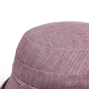 Detailed macro view of the purple woven fabric texture and stitching on the sun hat