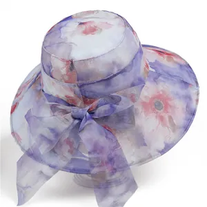Elegant floral sun hat for elderly women with wide brim and mesh bow decoration