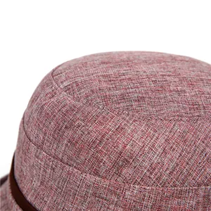 Macro shot of breathable linen-texture fabric and reinforced stitching on women's sun hat