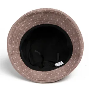 Internal view of brown sun hat for elderly women showing adjustable strap and lining