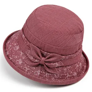 Breathable dark red sun hat for elderly women with decorative bow and star pattern band