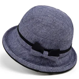 Elegant blue-gray linen bucket hat for elderly women with black band and bow detail