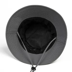 Detail of outdoor sun hat featuring breathable mesh lining and adjustable windproof strap