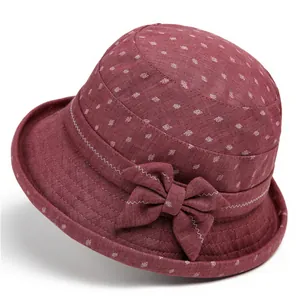 Women's burgundy floral sun hat with leaf pattern and elegant bow for seniors