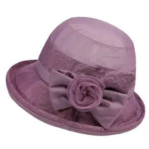 Elegant purple sun hat for women with lace floral patterns and a large mesh rose bow