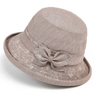 Elegant light brown sun hat for elderly women with bow detail and geometric patterns
