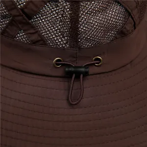 Detail of breathable brown mesh vents and adjustable elastic drawstring on sun hat
