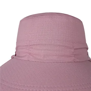Detail of reinforced double stitching and soft pleats on a purple sun hat brim