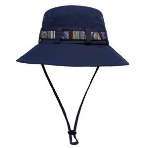 Detail of navy sun hat with ethnic woven band, wide brim, and metal eyelets for breathability