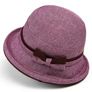 Elegant purple cloche hat for elderly women featuring a breathable fabric and brown bow