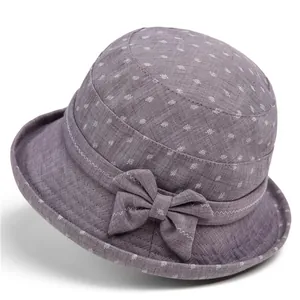 Detail of floral printed bucket hat featuring a 3D bow and reinforced stitching brim