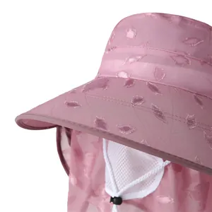 Detail of pink sun hat with leaf embroidery, neck cover and breathable mesh mask