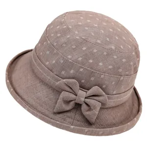 Women's light brown cotton sun hat with white leaf print and side bow decoration