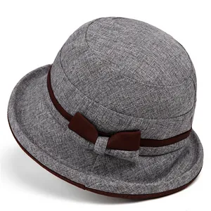 Close-up of gray sun hat with brown bow and knitted texture for senior women