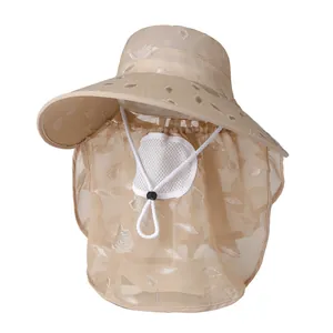 Detail of khaki sun hat featuring leaf embroidery, face mesh, and neck protection