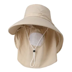 Detail view of beige sun hat with wide brim, face mesh, and neck protection for outdoor use