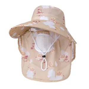 Detail view of the breathable mesh face mask and floral sun hat with adjustable wind cord