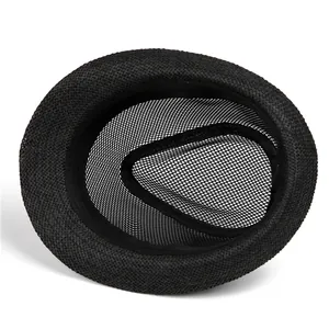 Detail of black fedora straw hat showing breathable mesh lining and sweatband inside