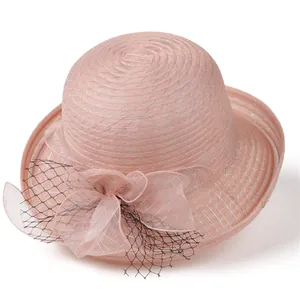 Close-up of pink organza bucket hat with elegant bow and silver mesh weaving detail