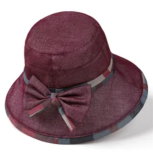 Elegant burgundy wide brim sun hat with ribbon bow and checkered trim for women
