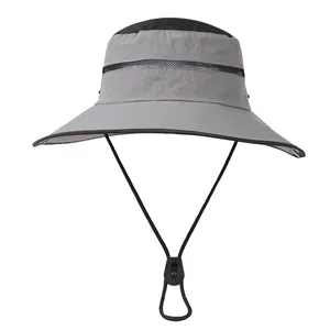 Detail of grey and black outdoor sun hat featuring breathable mesh crown and chin strap