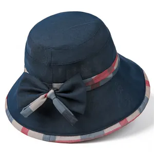 Elegant navy blue sun hat for women with checkered bow detail and breathable fabric