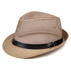 Detailed macro of the breathable mesh weave and leather strap on a khaki fedora hat
