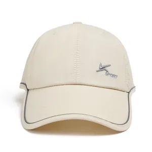 Detail of beige baseball cap featuring breathable mesh panels and V SPORT embroidery