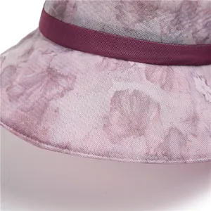 Elegant lavender sun hat for elderly women featuring mesh floral design and wide brim