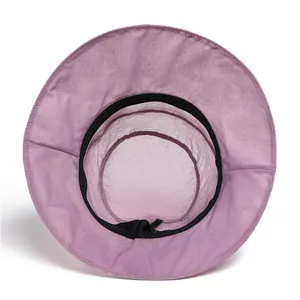 Detail of light purple sun hat featuring breathable mesh crown and interior sweatband