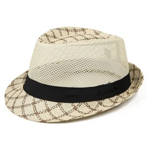 Detail of breathable mesh weave and brown plaid pattern on a men's summer straw hat