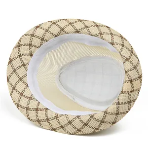 Detail of breathable mesh lining and plaid straw texture on a classic men fedora hat