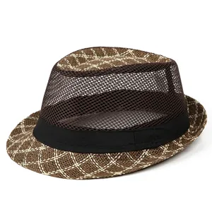 Detail of brown straw fedora hat with breathable mesh crown and black ribbon band