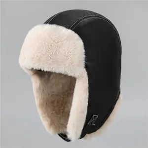 Detail of faux leather trapper hat with thick plush lining and white contrast stitching