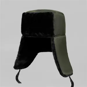 Winter thermal trapper hat in olive green with thick black faux fur earflaps for men