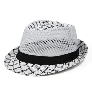 Detail showing white mesh breathable fabric and houndstooth pattern on men's straw fedora