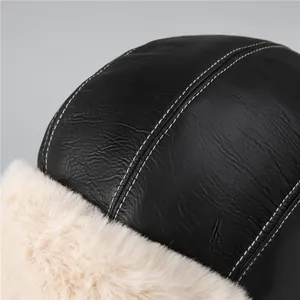 Detail of pilot hat showing black leather texture with white faux fur lining and stitching