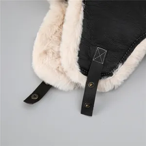 Winter aviator trapper hat in black faux leather with warm thick white faux fur lining