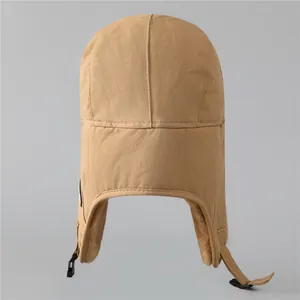 Khaki winter bomber hat with thick plush lining and ear flaps for cold outdoor activities