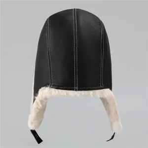 Winter aviator trapper hat with black leather exterior and warm white faux fur lining