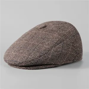 Close-up of winter brown tweed flat cap for men with thick warm wool texture