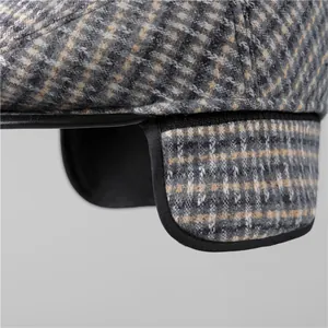 Winter plaid flat cap for men with warm ear flaps and high-quality leather piping trim
