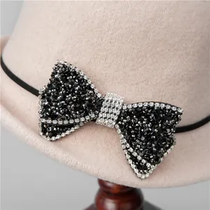 Elegant wool felt cloche hat for women with a sparkling rhinestone bow detail