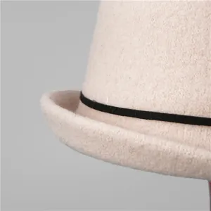 Elegant beige wool felt cloche hat with black ribbon trim and vintage French style