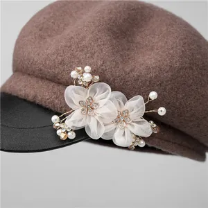 Brown wool newsboy hat with faux leather brim and luxury handmade floral ornament