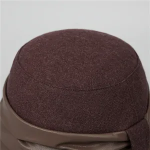 Winter wool cloche hat for elderly women featuring burgundy felt and textured leather trim